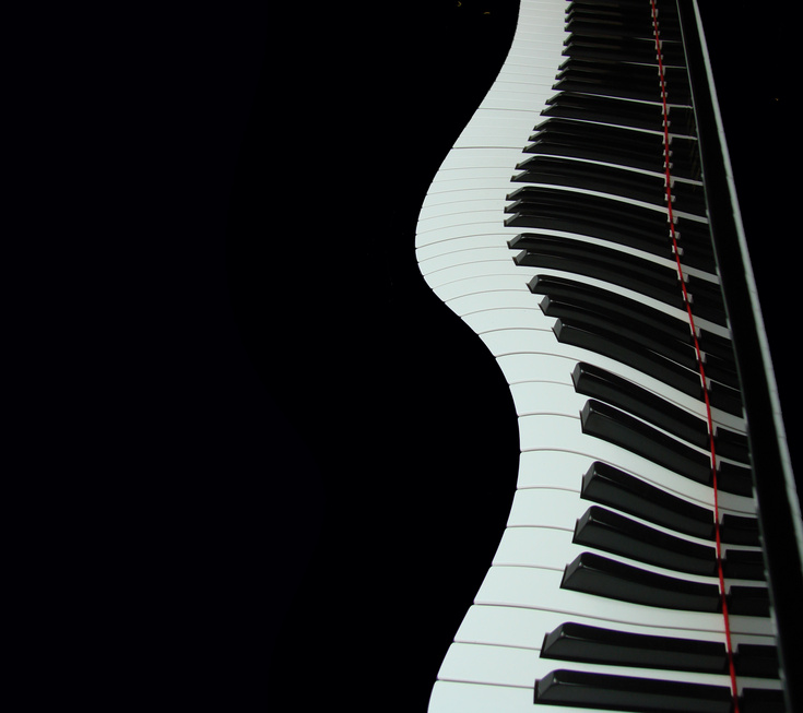 "Piano keys arranged in a wavy line."