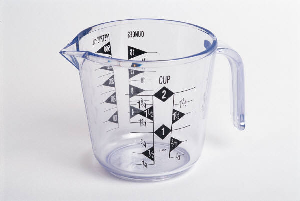 Various baking and cooking equipment including measuring cups, mixing bowls, and utensils.