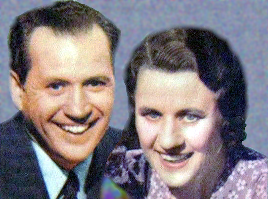 Jim and Mary and Jordan posing for the camera in 1941. The vintage black and white illustration of a couple sitting in a cozy living room. Fibber is holding a newspaper and Molly is knitting. They are both looking at a small dog that is sitting on a rug between them. The room is decorated with a patterned wallpaper, framed pictures, and a vase with flowers on a table in the background."
