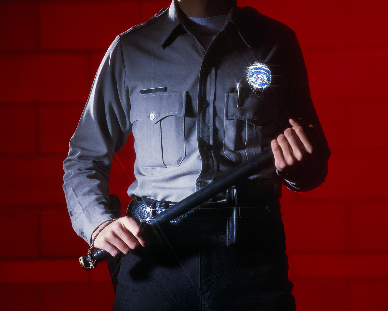 Badges. night sticks, police officers.